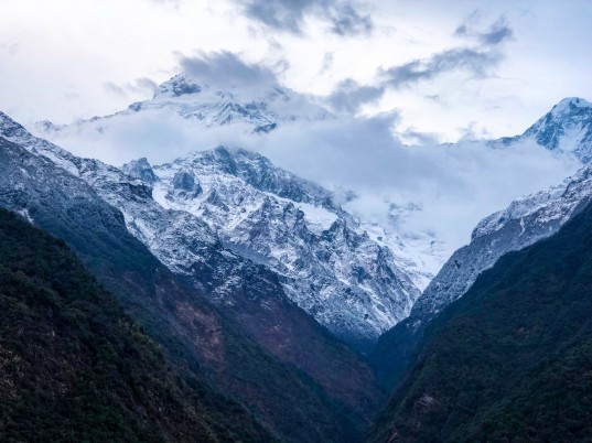 Snowy Mountain with Majestic Clouds
